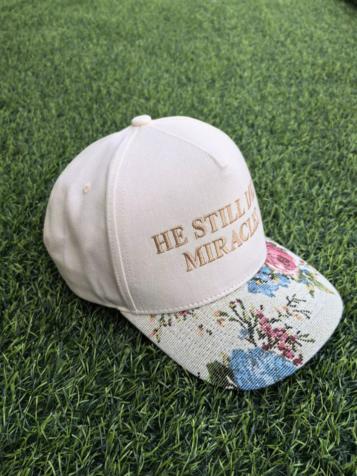 Neutral “He Still Does Miracles” Floral Trucker Hat
