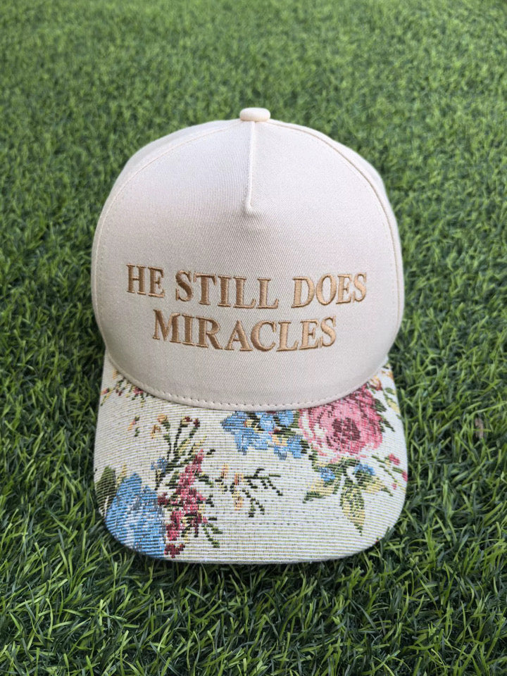 Neutral “He Still Does Miracles” Floral Trucker Hat